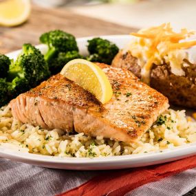 Grilled Salmon: Try our salmon grilled, blackened or bourbon-glazed over rice. Served with two sides.