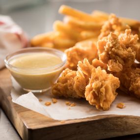 Chicken Tender Plater: A meal fit for a champion, our hand-breaded chicken tenders are made to order. Choose from classic, Buffalo or honey hot. Served with two sides.