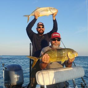 Miami anglers with their catch of the day on our fishing boat