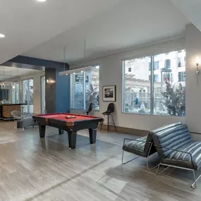 Lounge area with billiards, ping pong, and foosball.