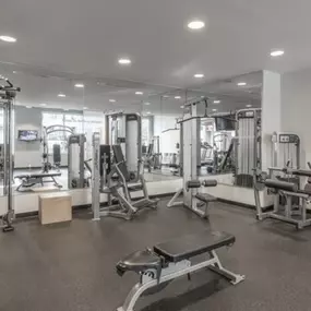 24 hour fitness center with cardio machines and free weights.