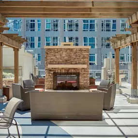 Outdoor terrace with fireplace and ample cabana seating.