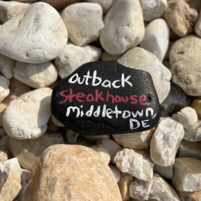 Outback Steakhouse Middletown Delaware rock painted with the words Outback Steakhouse Middletown Delaware