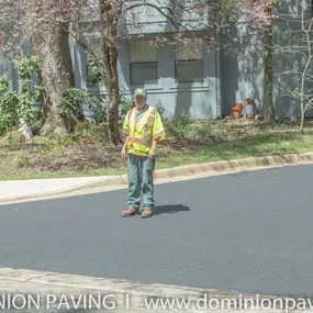 Dominion Paving Employee Standing on Newly Paved Road