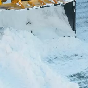 Snowcat removing snow from a road