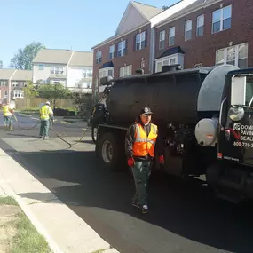 Dominion Paving contractors laying down fresh asphalt