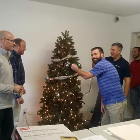 Dominion Paving Employees Decorating Christmas Tree