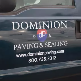 Dominion Paving Work Truck Featuring the company's website and phone number