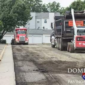 Dominion Paving work trucks on dirt road