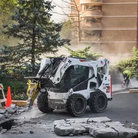 Dominion Paving Contractor Operating a Bobcat