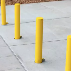 Our team provides extensive bollard installation services for cities and suburbs throughout Northern Virginia, Maryland, Eastern West Virginia, and the D.C. Metro Area. Bollards are short, sturdy posts placed in pedestrian areas to protect people from vehicular traffic and deter unauthorized vehicle access.