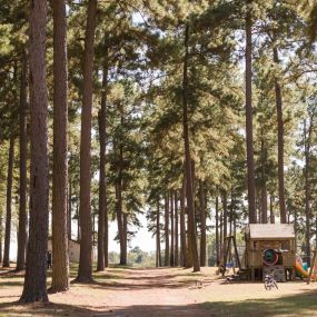 Our spacious campground also contains a quaint playground with swings, a few slides, sand box, and benches.