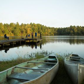 Paddle for hours, surrounded by peaceful ripples and a reflective shoreline of pines.