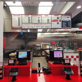 An interior photograph of the order area and kitchen for the Five Guys restaurant in Haymarket, Virginia.