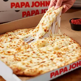 Original fresh dough covered with Special Garlic sauce, topped with mounds of real cheese made from mozzarella, then baked to a cheesy, gooey goodness. Served with original pizza sauce for dipping!