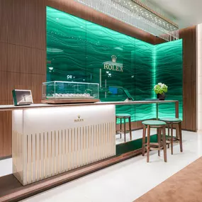 Along the backwall of the showroom lies a beautiful wave of Rolex green glass – currently the only boutique wall with a 90 degree corner in glass in the country.