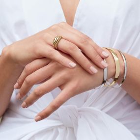 Bangles bracelets and a yellow gold ring.