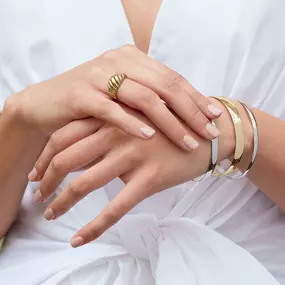 Bangles bracelets and a yellow gold ring.