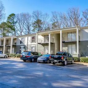 Elliot Norcross Apartments offers an exterior view that highlights convenient resident parking.