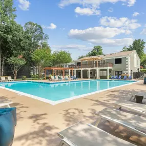 Elliot Norcross Apartments features a swimming pool with an adjacent sundeck and a view of the resident clubroom.