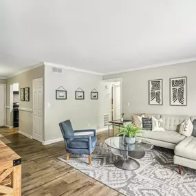 The living room at Elliot Norcross Apartments offers a welcoming and open space for relaxation.
