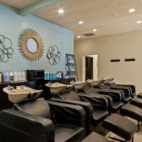 Our beautiful setup features five shampoo bowls with super comfy lounge chairs. Each shampoo includes an amazing scalp massage, ensuring a relaxing and rejuvenating experience.