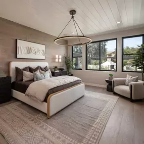 Serene primary bedroom suite with wood accent wall