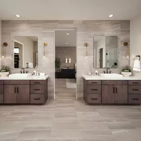 Primary bathroom with two vanities and expansive walk-in shower