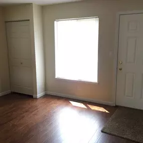 Room with front door and window