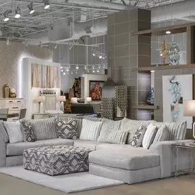 Cozy living room display with modern sectional and decor.