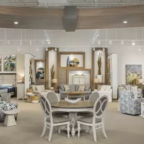 Coastal-inspired showroom display with elegant furniture.