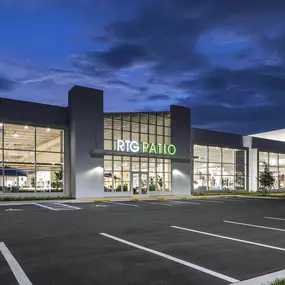 RTG Patio showroom exterior illuminated during twilight.