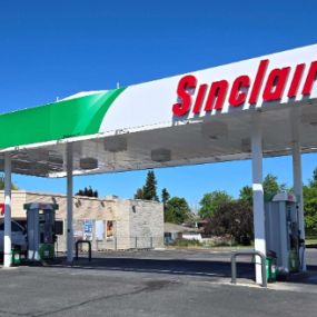 Sinclair fueling island and DINO Mart gas station