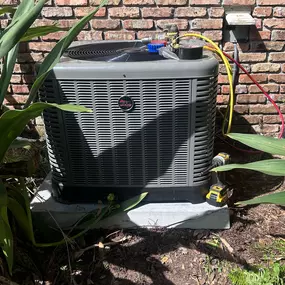 This image features a RUUD A/C compressor with tools and meters attached, highlighting expert air conditioning repair and maintenance services provided by Tri-County HVAC in Wellington, FL. Trusted for A/C repair, installation, and maintenance 