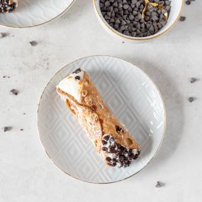 Little bites of heaven! These crispy cannoli shells filled with creamy ricotta are perfect for satisfying your sweet tooth in the most delightful way.