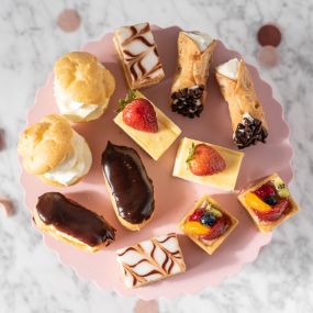 A delightful array of bite-sized bliss! Each mini pastry is a perfect little indulgence, ideal for impressing your guests and treating yourself.