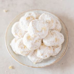 Sweet memories in every bite! These delicate, powdered sugar-coated delights are perfect for sharing with loved ones over a cozy cup of tea.
