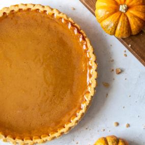 A slice of autumn! This classic pumpkin pie, with its spiced filling and golden crust, is perfect for cozying up any fall day.