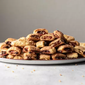 A delightful twist! These crescent-shaped pastries filled with raspberry and chocolate are a perfect blend of flavors.