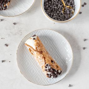 Little bites of heaven! These crispy cannoli shells filled with creamy ricotta are perfect for satisfying your sweet tooth in the most delightful way.