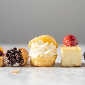 Tiny treats, big smiles! This elegant assortment of bite-sized pastries adds a touch of sweetness and sophistication to any celebration.