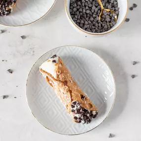 Little bites of heaven! These crispy cannoli shells filled with creamy ricotta are perfect for satisfying your sweet tooth in the most delightful way.