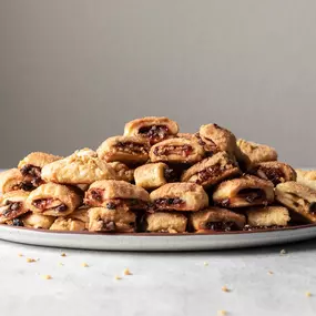 A delightful twist! These crescent-shaped pastries filled with raspberry and chocolate are a perfect blend of flavors.