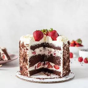 Decadence redefined! Dive into layers of rich chocolate cream and cake, topped with strawberries for that perfect touch of indulgence.