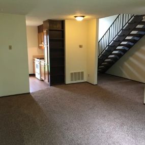 Living room and hallway with stairs