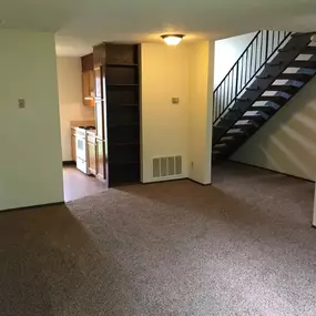 Living room and hallway with stairs