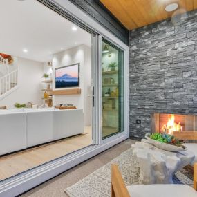 Seamless indoor-outdoor living to the covered patio with gas fireplace