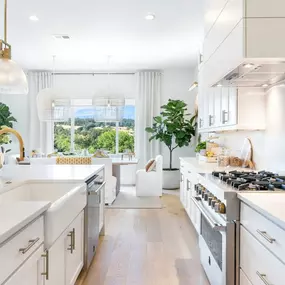 Bright, open kitchen and dining area of the Silas home design