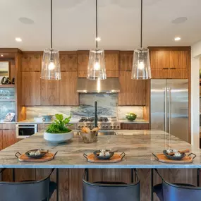 Well-designed kitchen with large center island and double-stacked cabinets