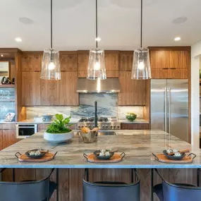 Gourmet kitchen with large center island and double-stacked cabinets